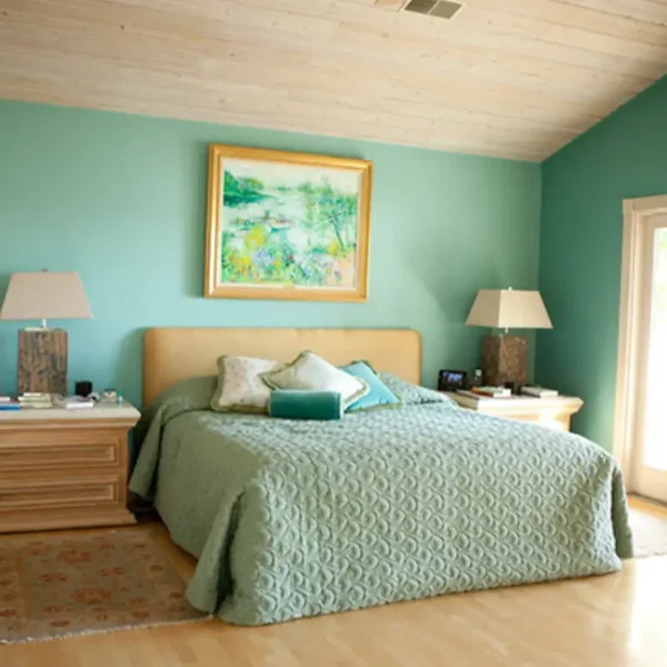 Beautiful teal bedroom interior design by AFAR Imports & Interiors, Springfield, IL, with custom bedding and vaulted wood ceiling