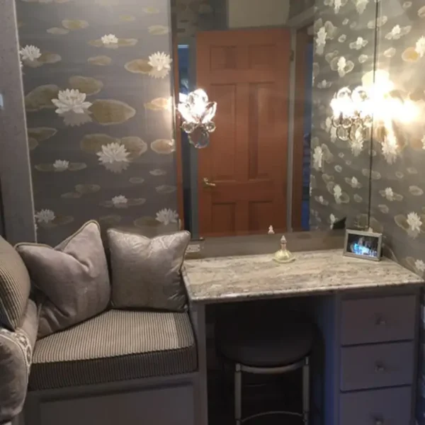 Custom upholstered window seat and vanity nook by AFAR Imports & Interiors, Springfield, IL, featuring water lily wallpaper
