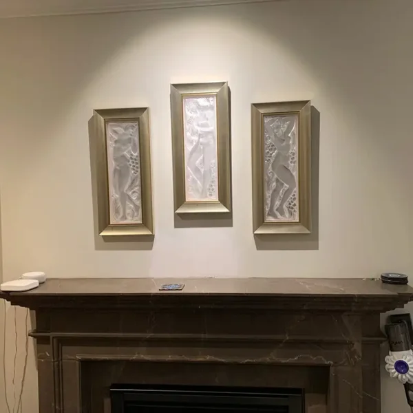 Custom framed art glass panels installed above fireplace mantel by AFAR Imports & Interiors, Springfield, IL