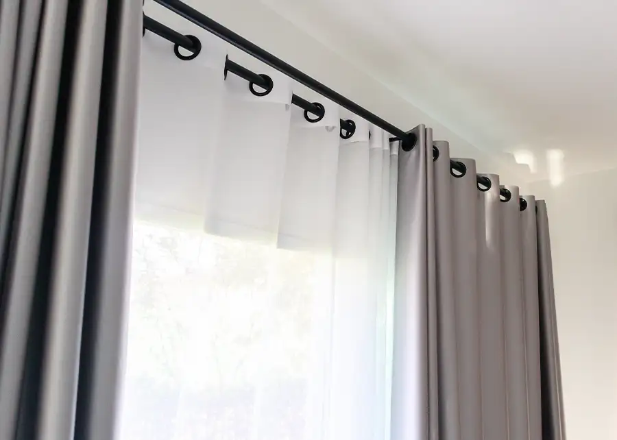Custom grommet draperies on black rod by Ash Street Upholstery in Springfield, IL window treatment design