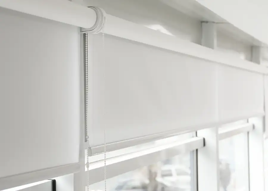 Custom white roller shade with pull chain by Ash Street Upholstery in Springfield, IL window treatment design