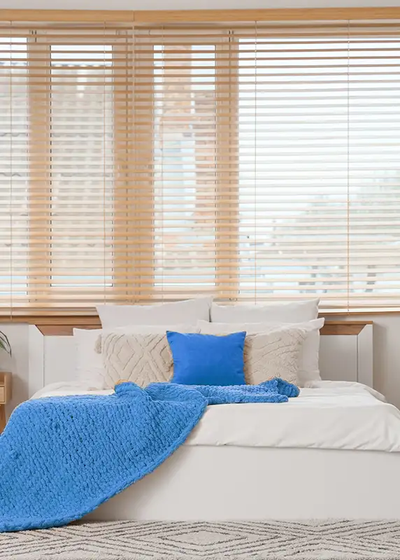 Bedroom with custom wood shades by Ash Street Upholstery in Springfield, IL window treatment design