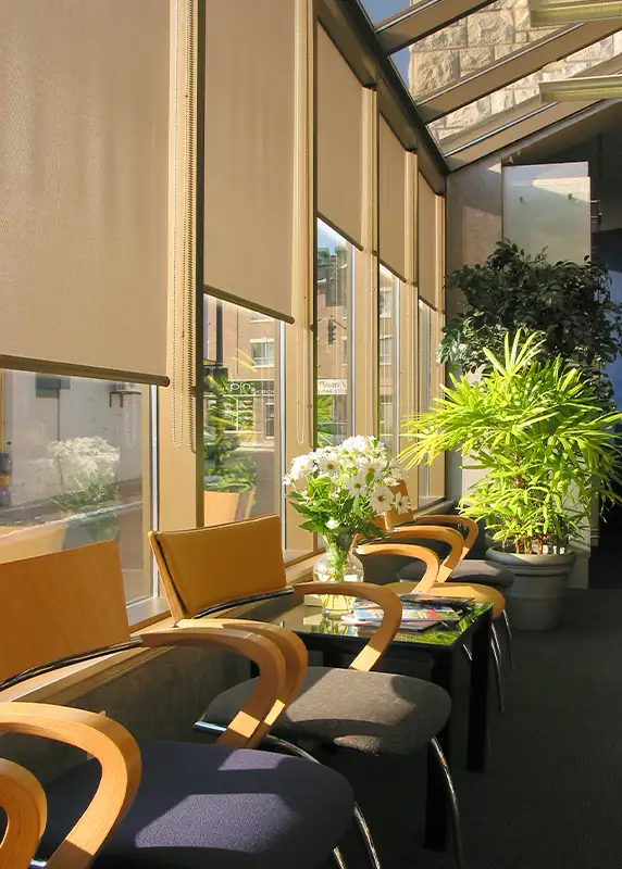 Commercial sunroom solar shades installed by Ash Street Upholstery in Springfield, IL window treatment design