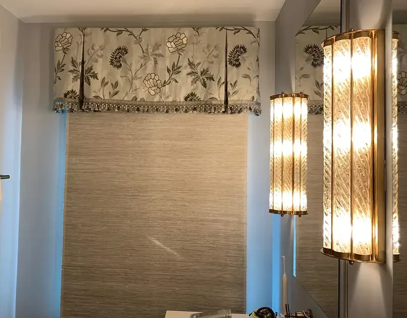 Custom floral cornice valance with beaded trim over woven wood shade by Ash Street Upholstery in Springfield, IL in remodeled bathroom