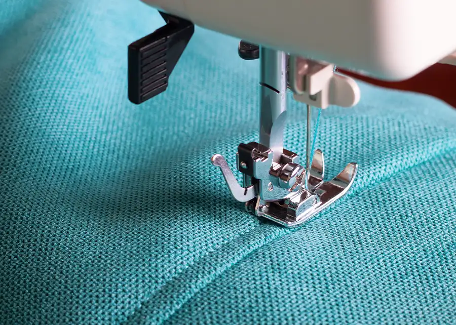 Custom upholstery sewing detail on teal fabric by Ash Street Upholstery, Springfield IL's trusted upholstery and drapery workroom